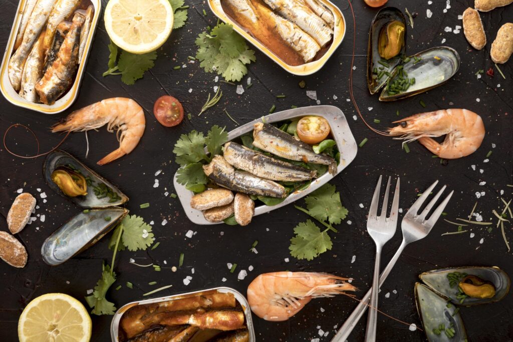 flat-lay-assortment-seafood-with-cutlery-scaled