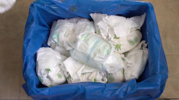 depositphotos_536507934-stock-video-wet-and-dirty-disposable-diapers